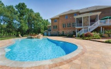Pool area with outdoor kitchen